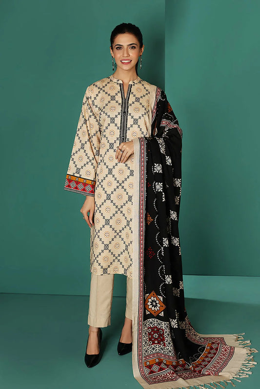 Woman wearing a traditional outfit with a black and white patterned dupatta on a teal background