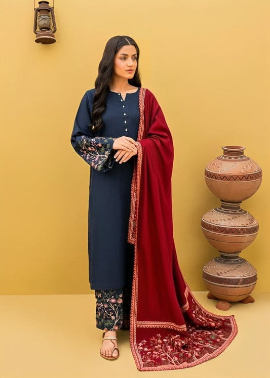 Woman in traditional outfit with red dupatta against a yellow wall
